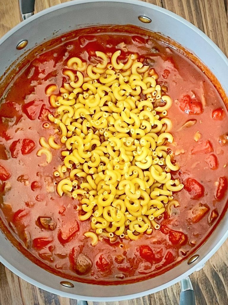uncooked pasta in sauce