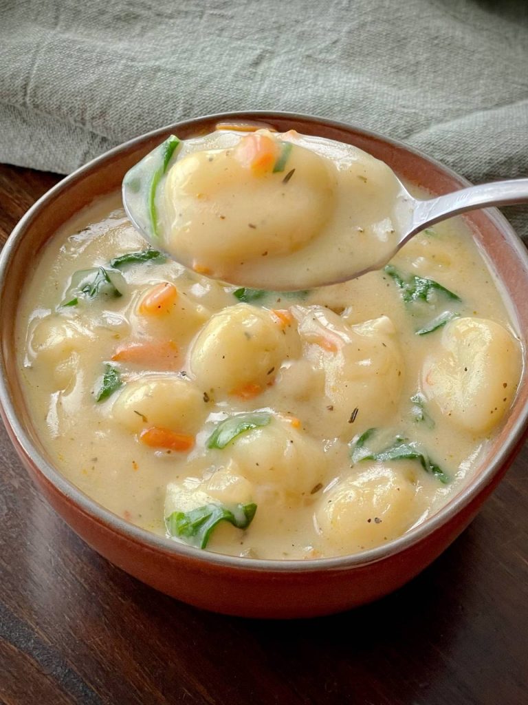gnocchi soup with spoon