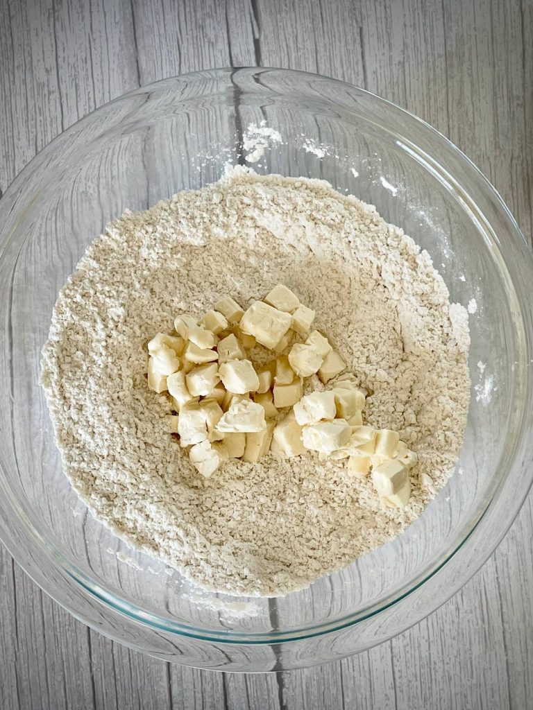 Butter cubes added to dry ingredients.