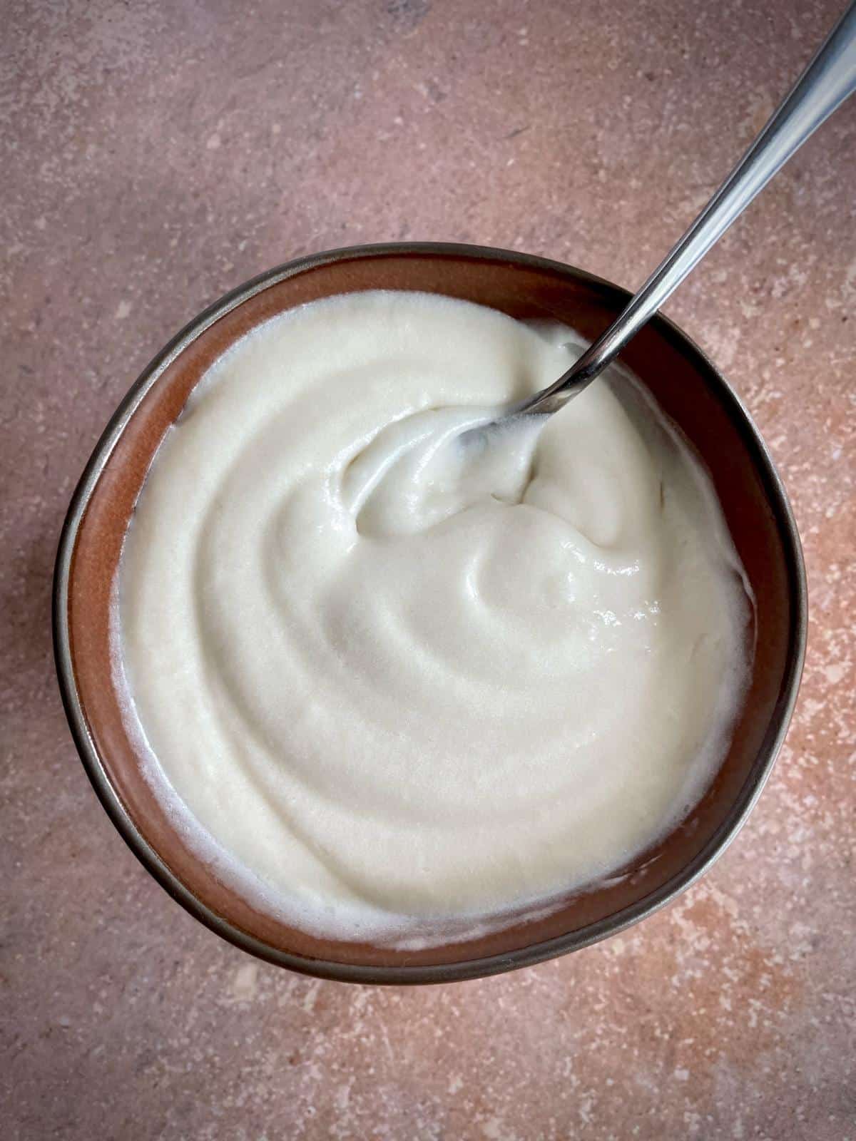 Bowl of cream cheese frosting.