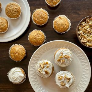 Carrot cake cupcakes with frosting and nuts featured image.