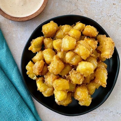 Cheese curds with dipping sauce.