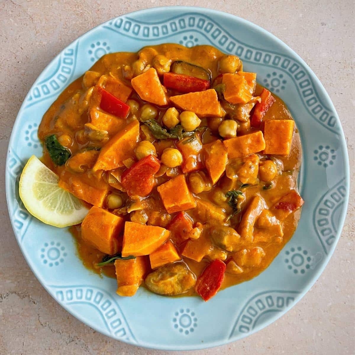 A bowl of sweet potato and mushroom curry.