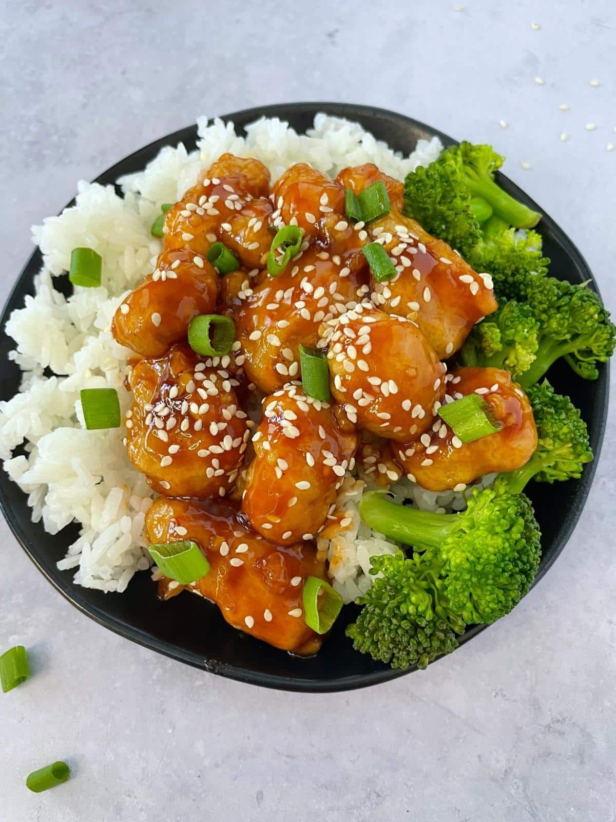 Sesame chicken with broccoli and rice.
