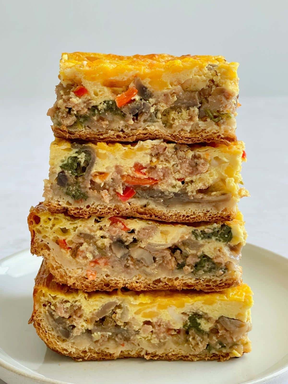 Stacked egg casserole slices.