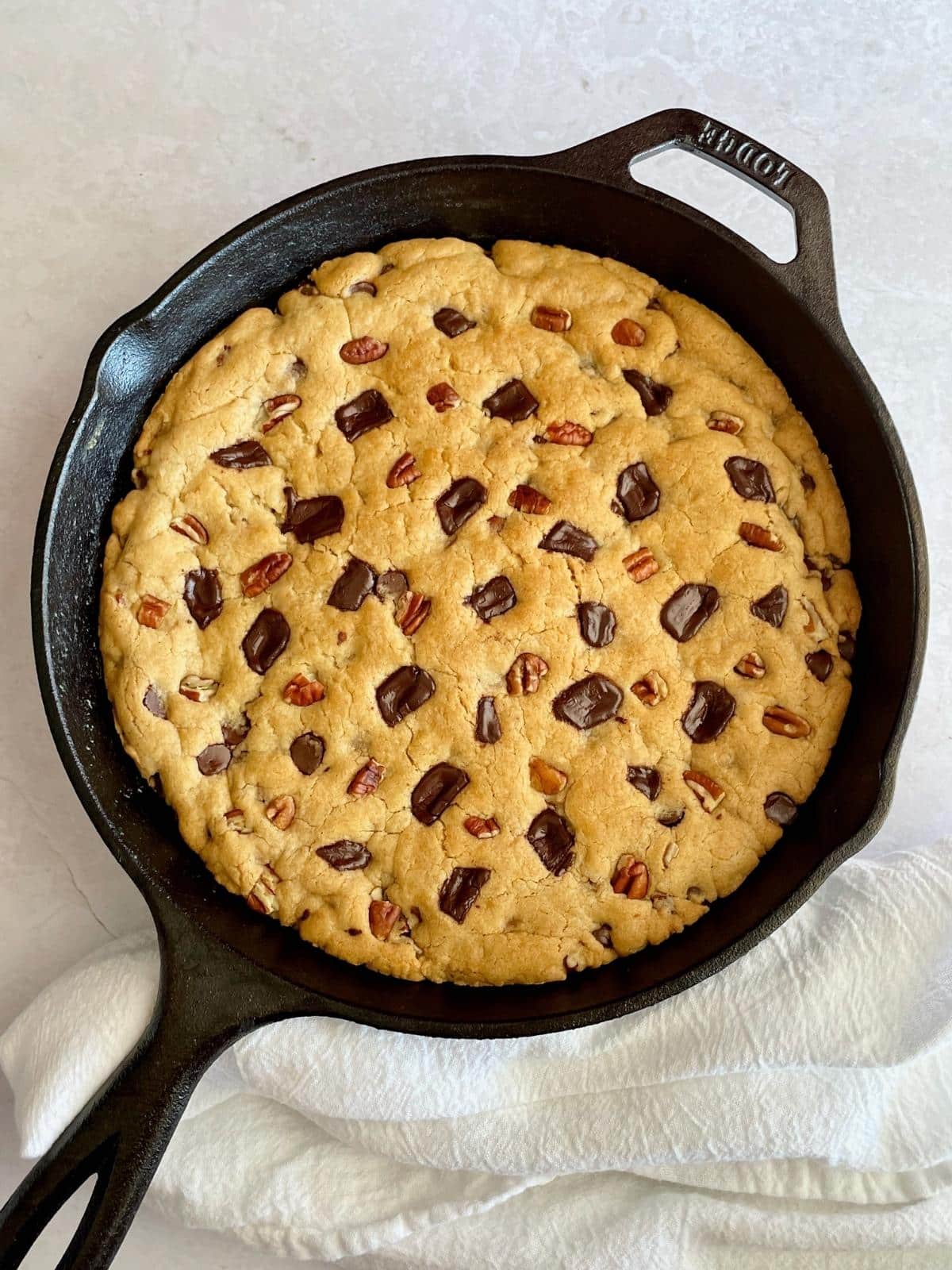 Chocolate chip cookie in deep dish pan.