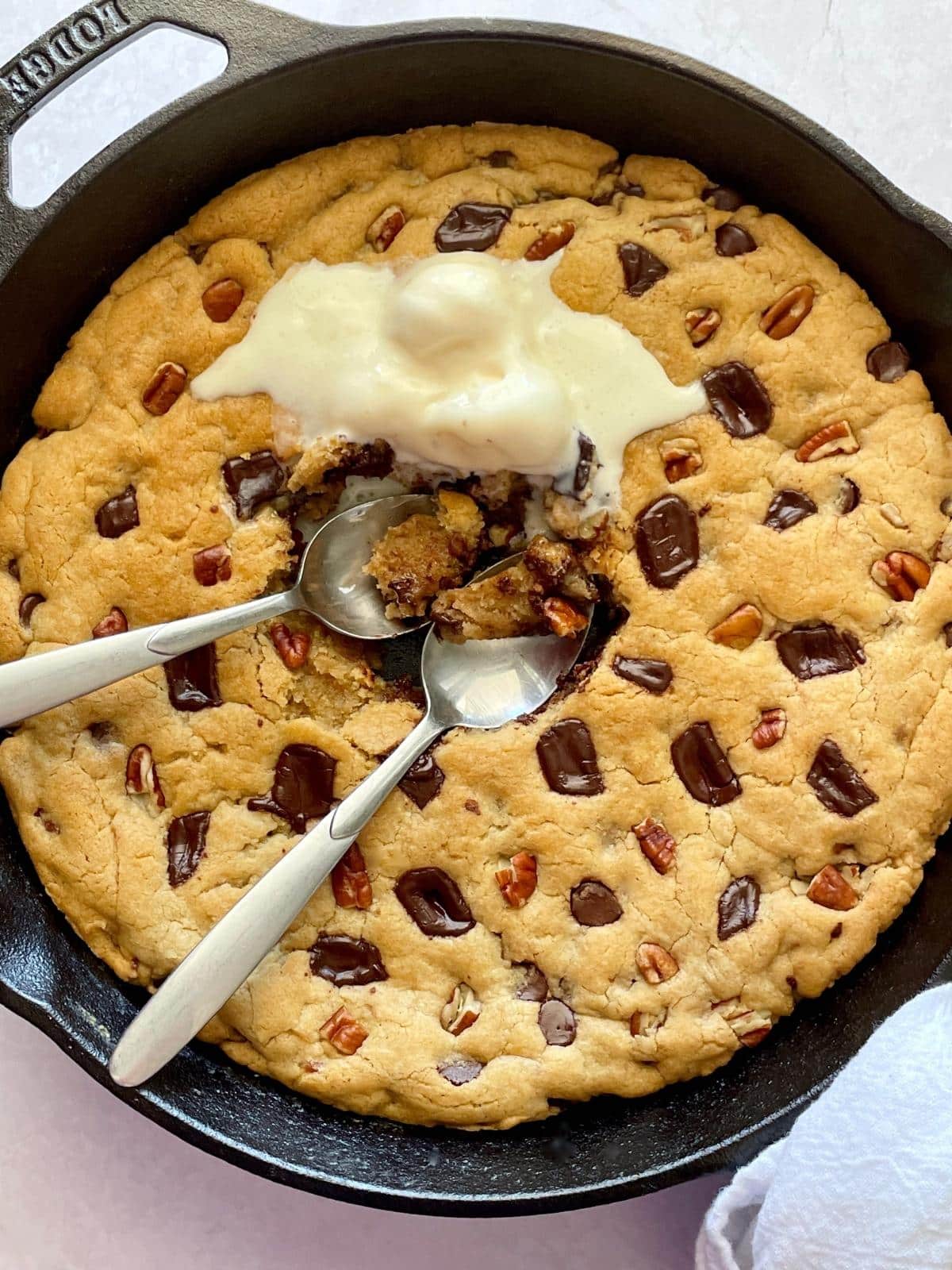 Eating the skillet cookie with ice cream.
