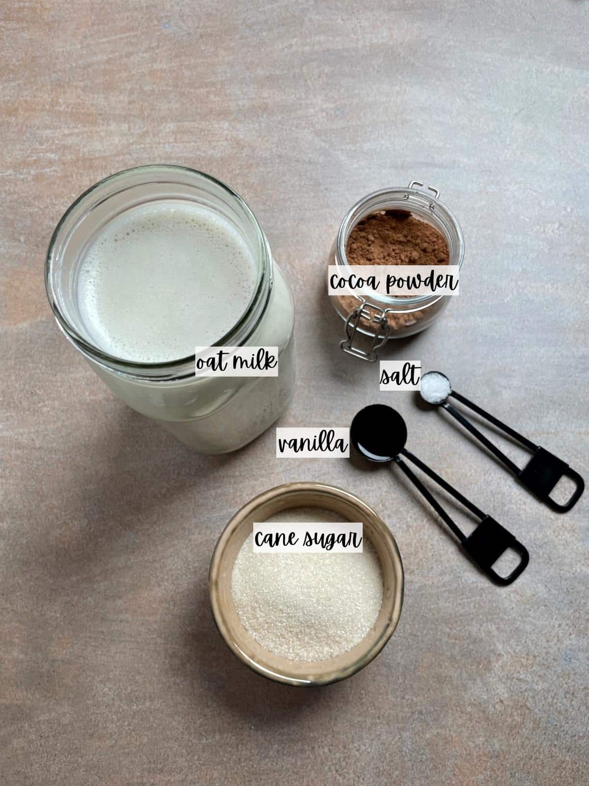 Labeled ingredients for oat milk hot chocolate.