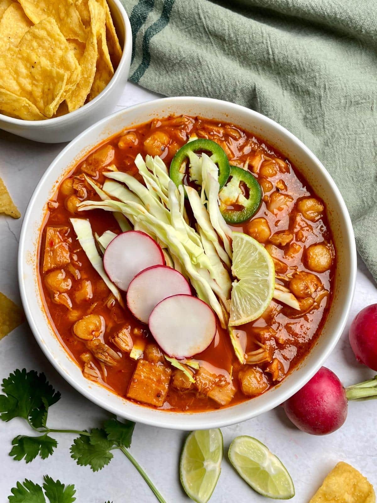 Vegan pozole rojo with toppings.
