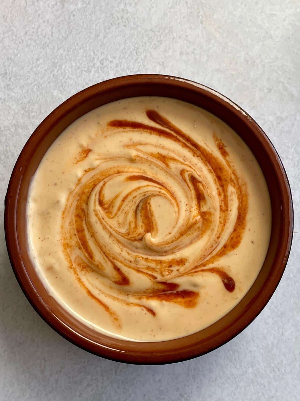 Spicy mayo in a dish.