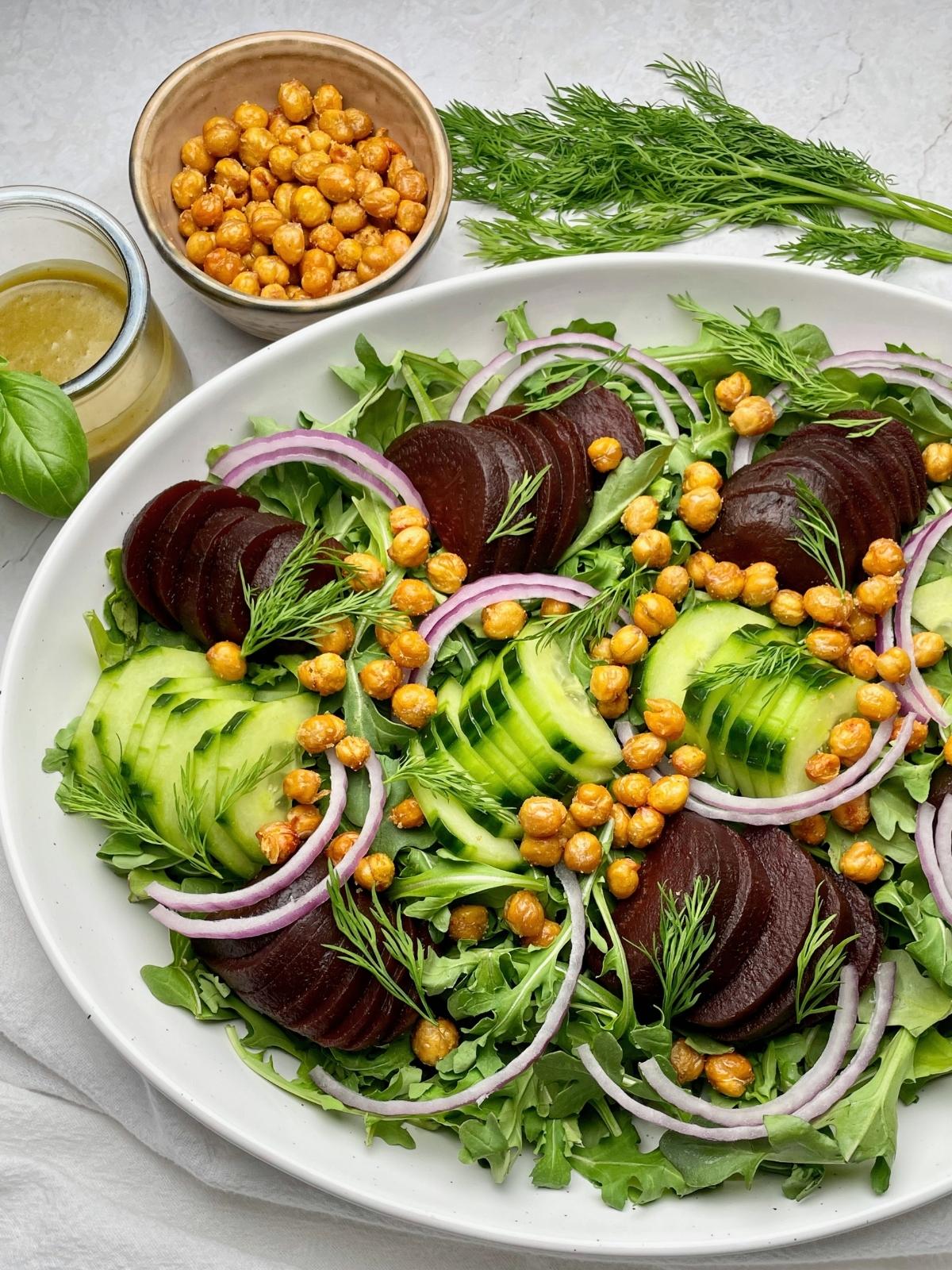 Roasted chickpeas on top of a beet salad.