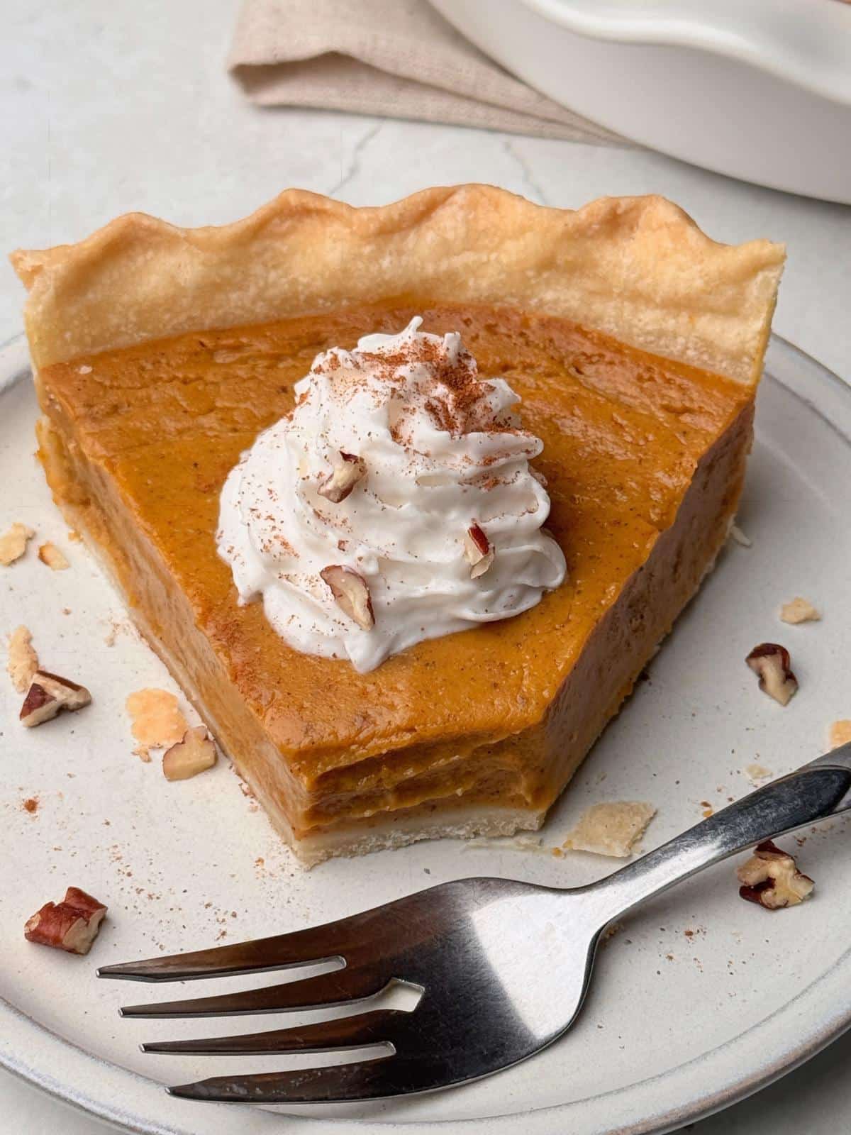 Eating pumpkin pie with a fork.