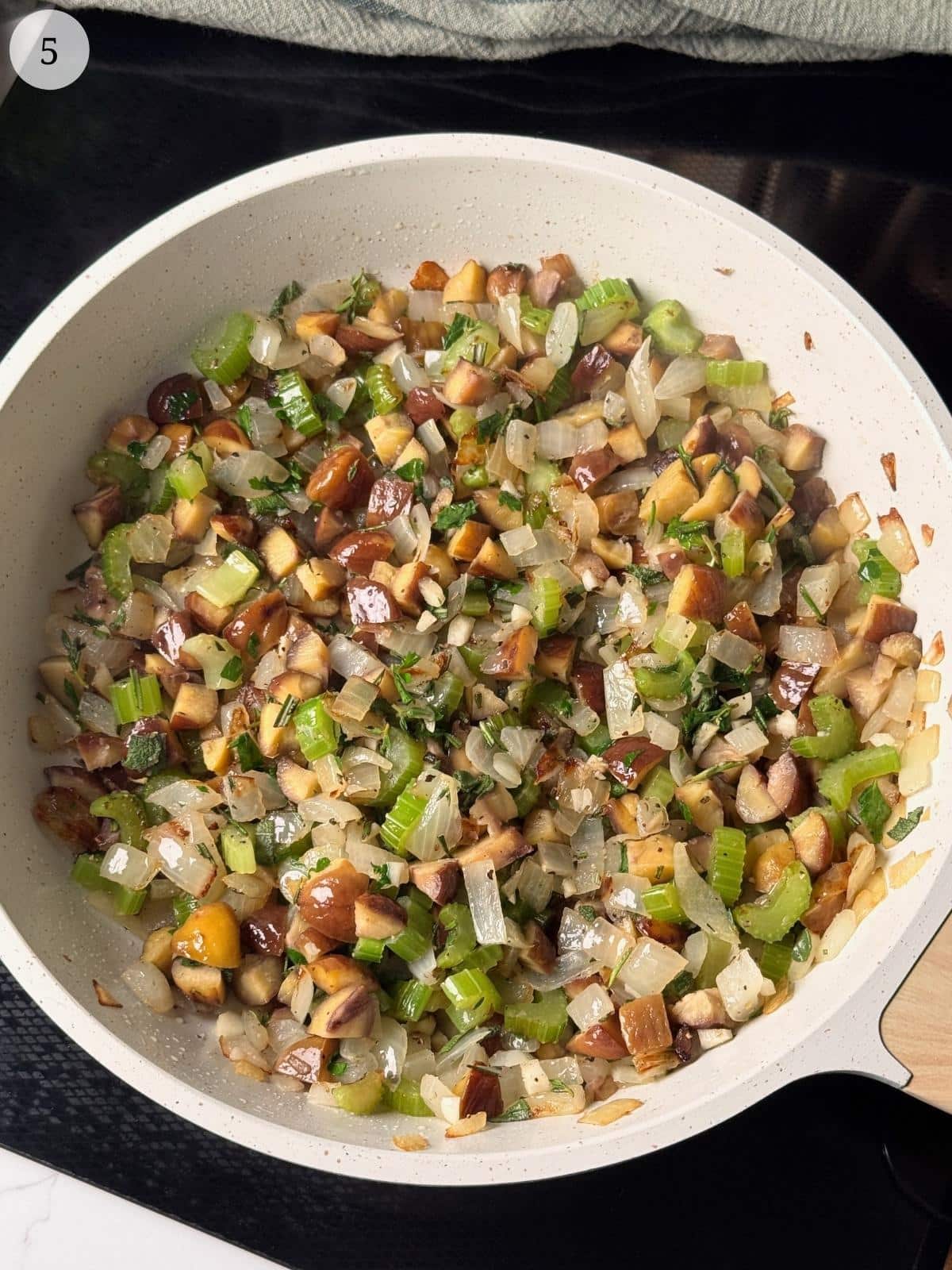 Sautéing chestnuts with herbs.