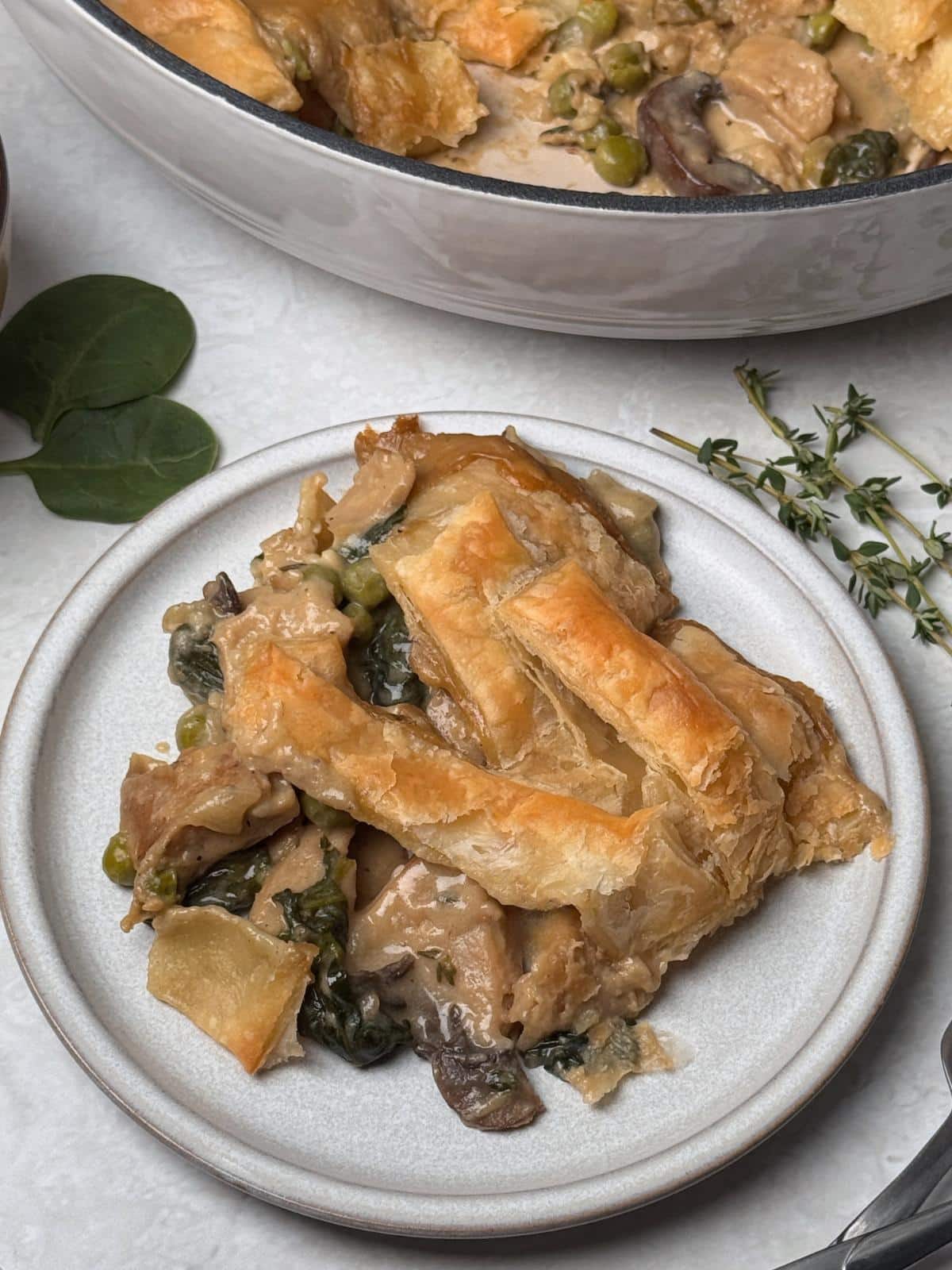 A large slice of vegan chicken mushroom pot pie.