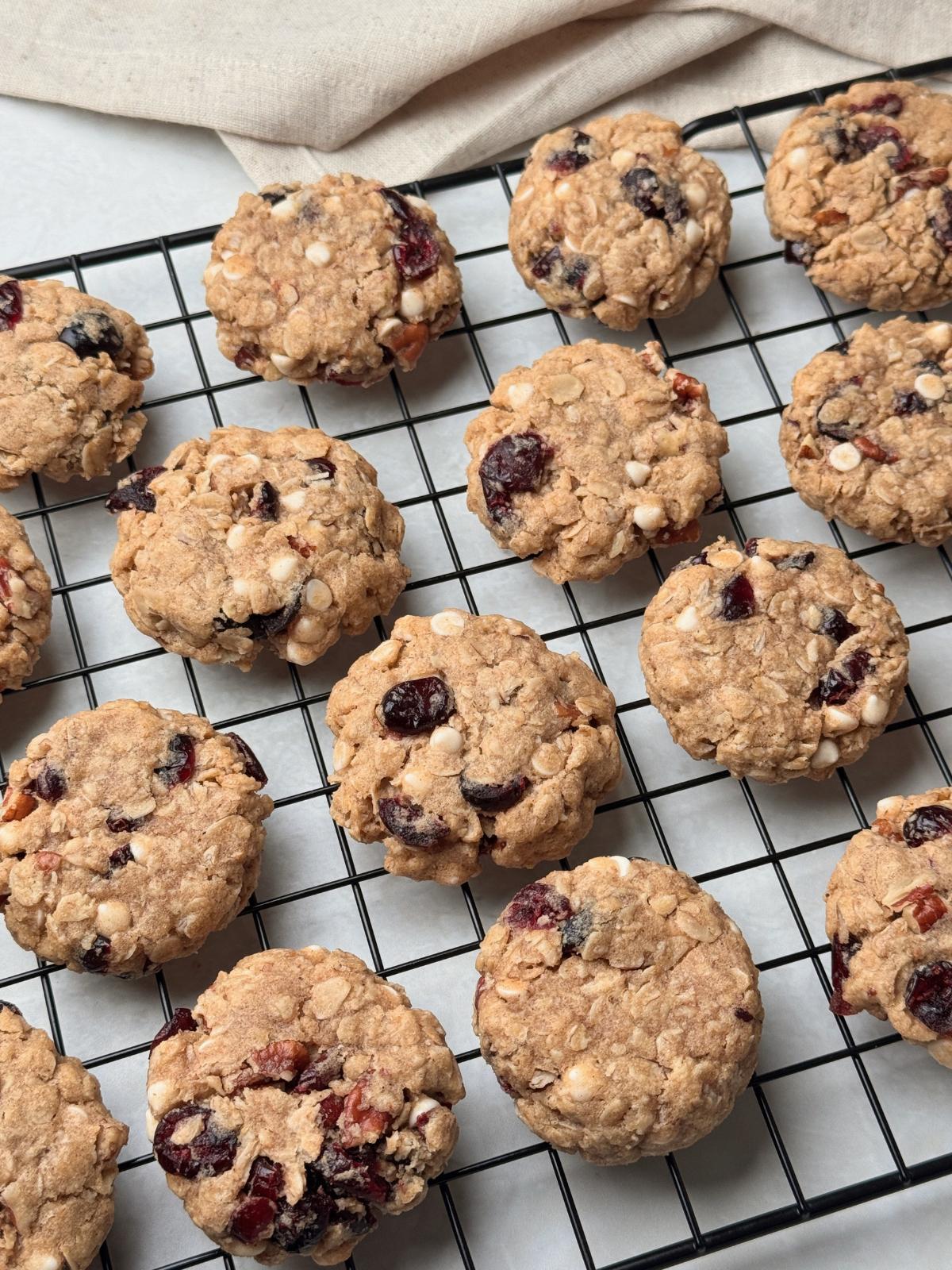 Oatmeal cranberry cookies on a cooling rack.
