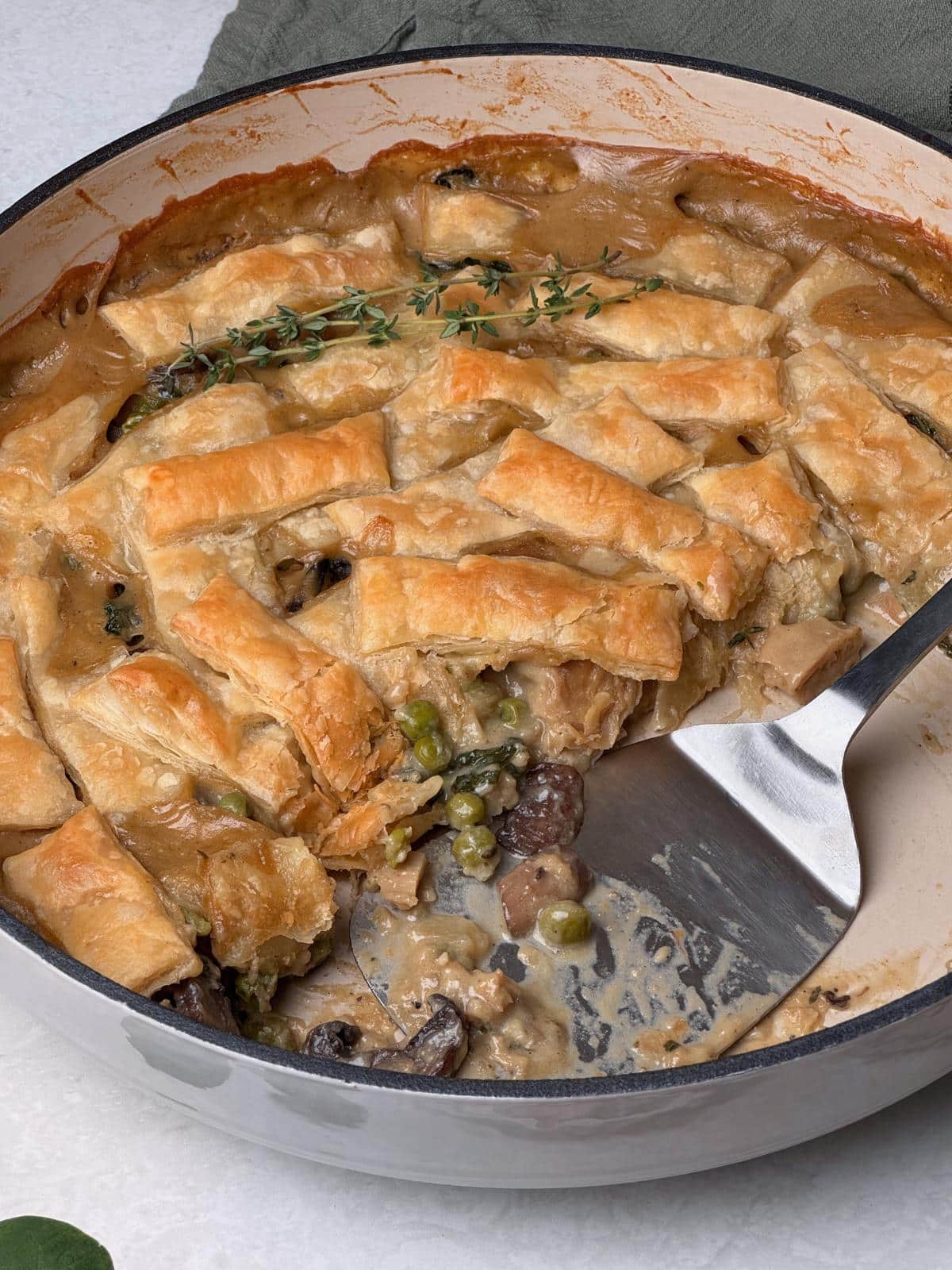 A large slice of vegan chicken mushroom pot pie.