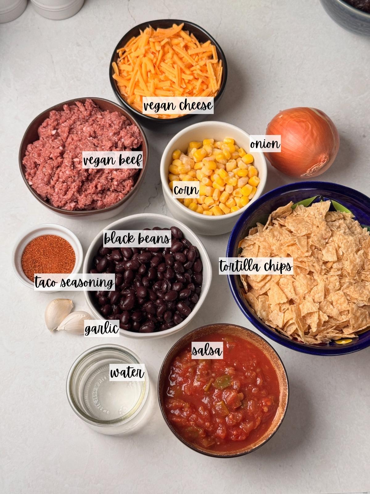 Labeled ingredients for a taco bake.