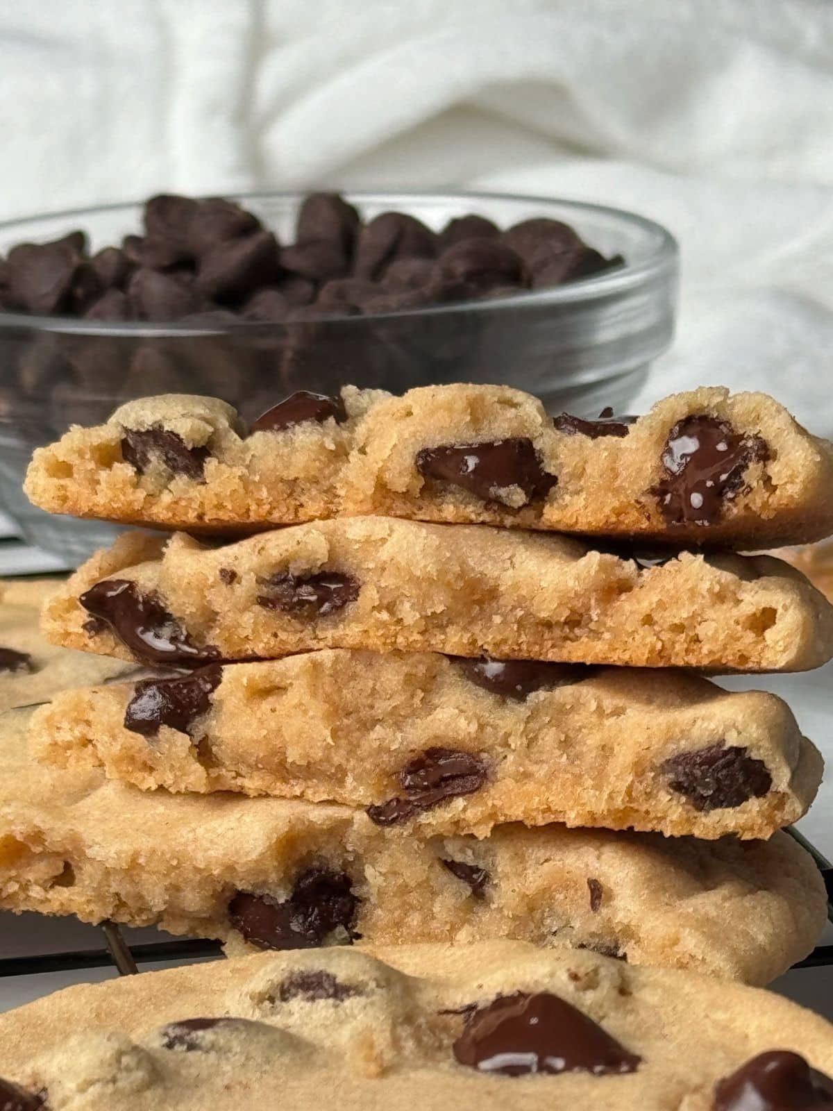 Stacked peanut butter cookies with chocolate chips.