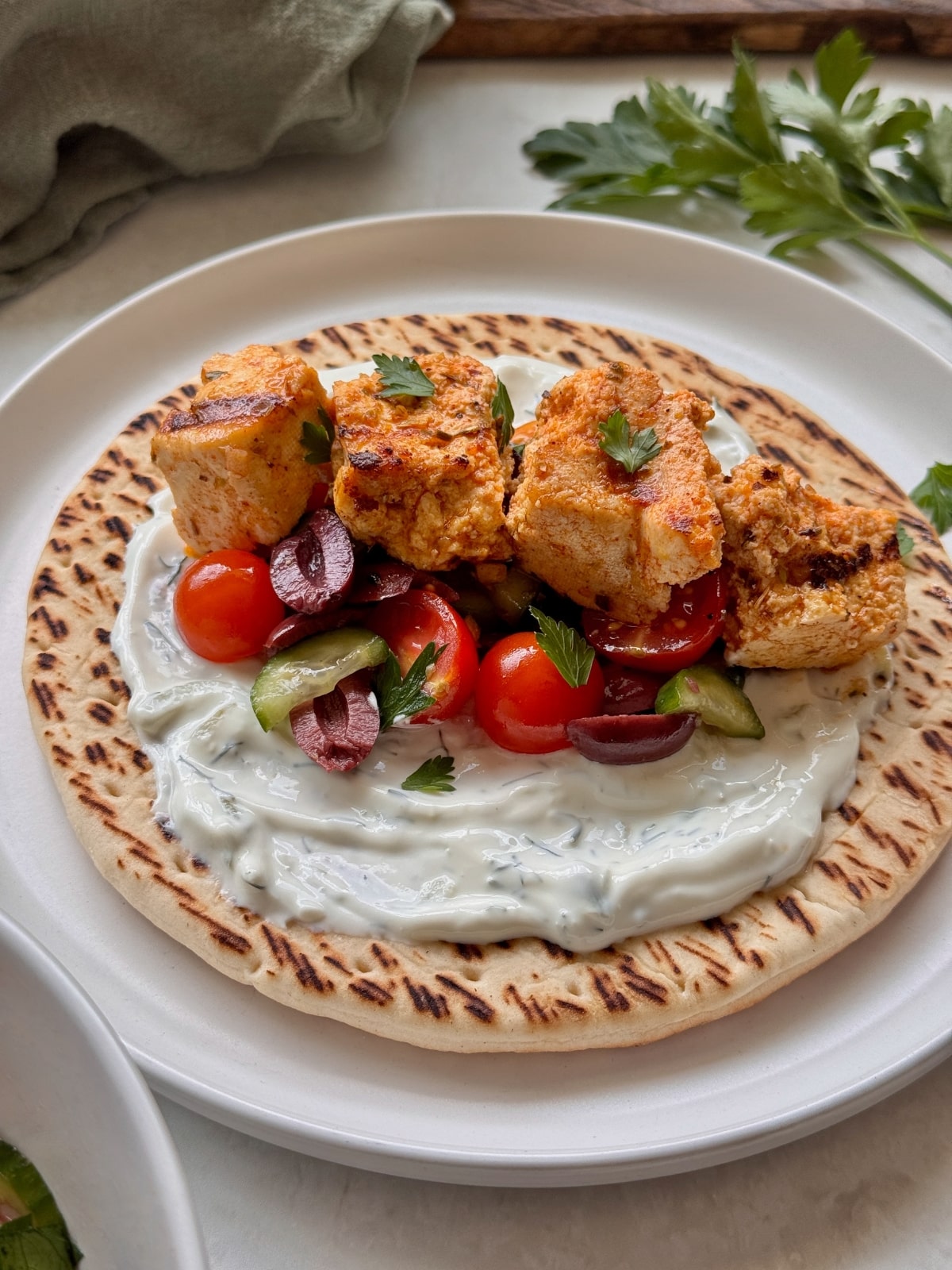 Souvlaki on pita with tzatziki.