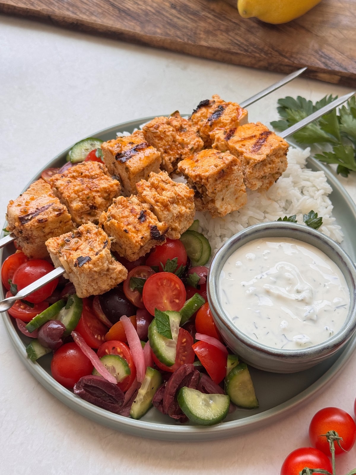 Souvlaki skewers over Greek salad.