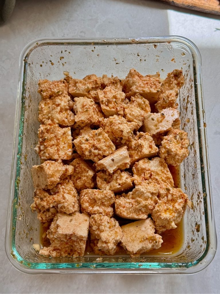Tofu pieces in souvlaki marinade.
